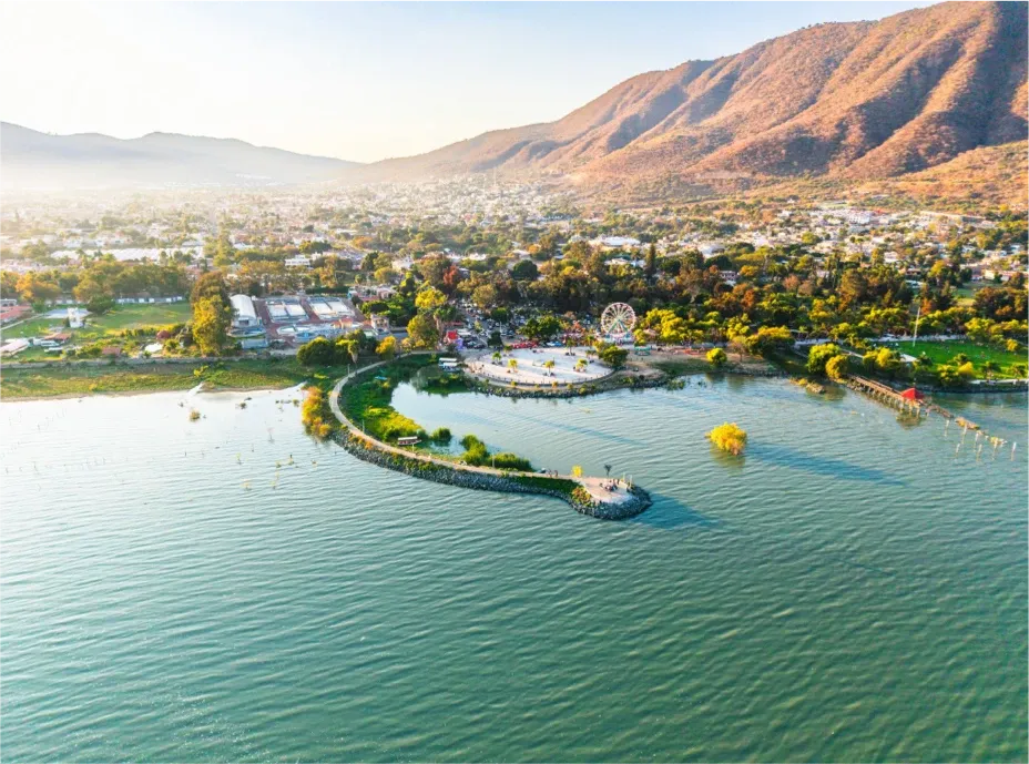 Aerial view of the Jocotepec boardwalk and Lake Chapala surrounded by mountains